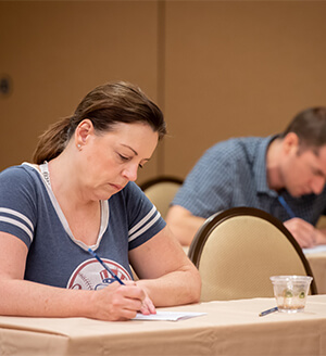 A photo of individuals getting ready to take the official Mensa Admission Test at the 2019 Annual Gathering.
