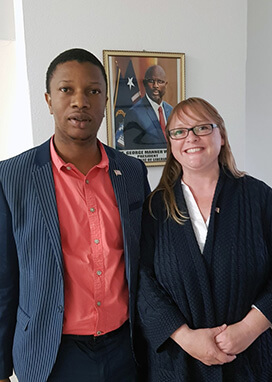 A photograph of Phil Dixon and Jane Allen meeting at the Embassy of Liberia in London