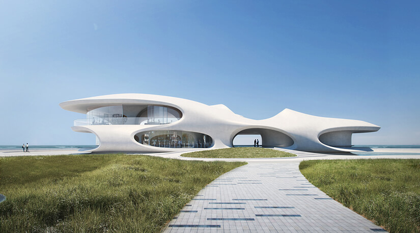 An external shot of the Wormhole Library. Green grass and a long concrete path in the foreground lead up to the library itself, with curved white and glass walls.