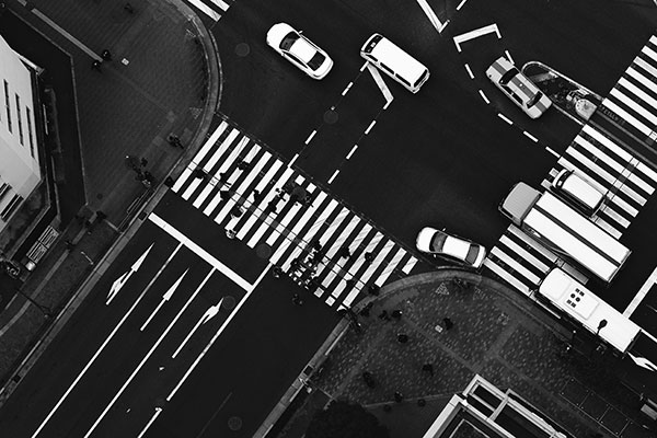 A black-and-white, overhead photo of a busy intersection