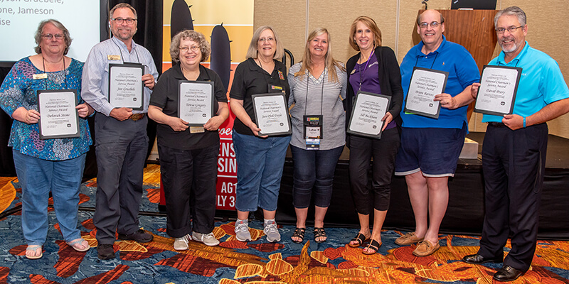 AMC Chair LaRae Bakerink in a photograph with the 2018 Chairman's Service Award winners