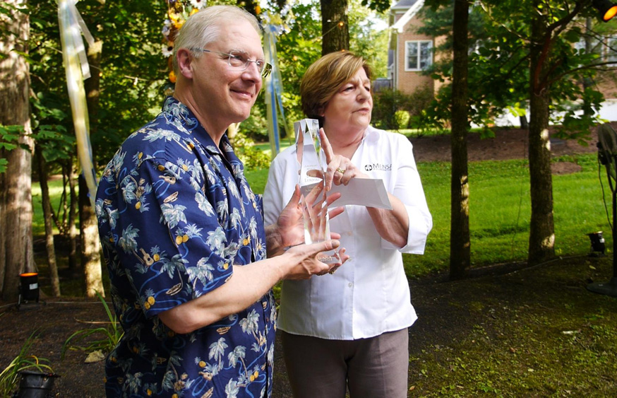 Phyllis Miller presents Dr. David Lubinski the 2015 Lifetime Achievement Award