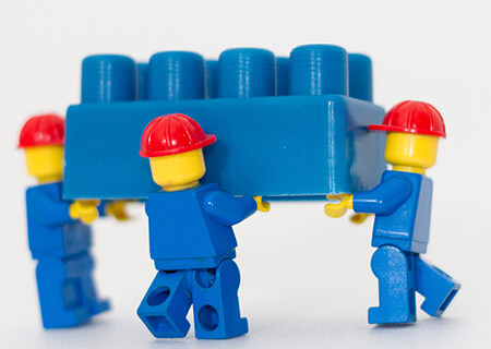 Minifigs carrying a blue lego