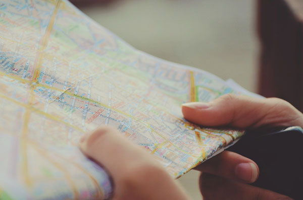 Person holding map photo