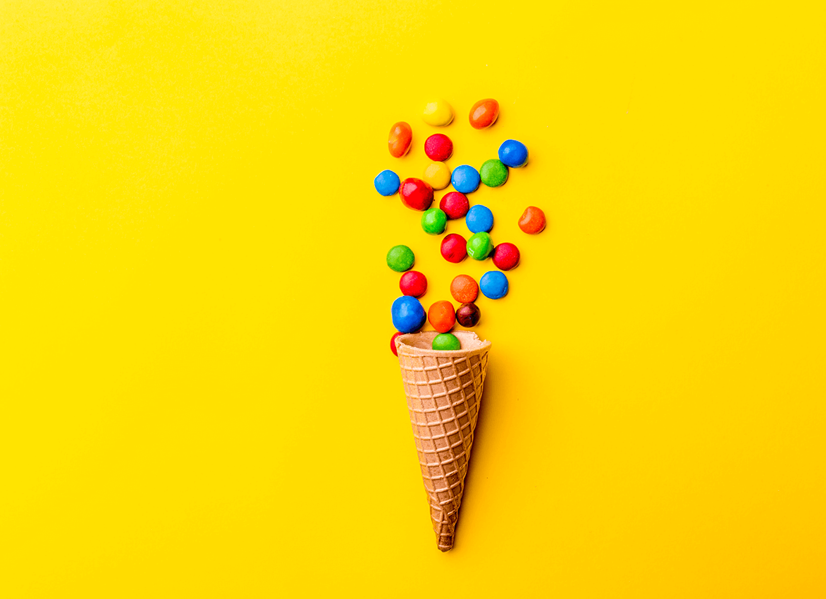 M&Ms falling into an ice cream cone